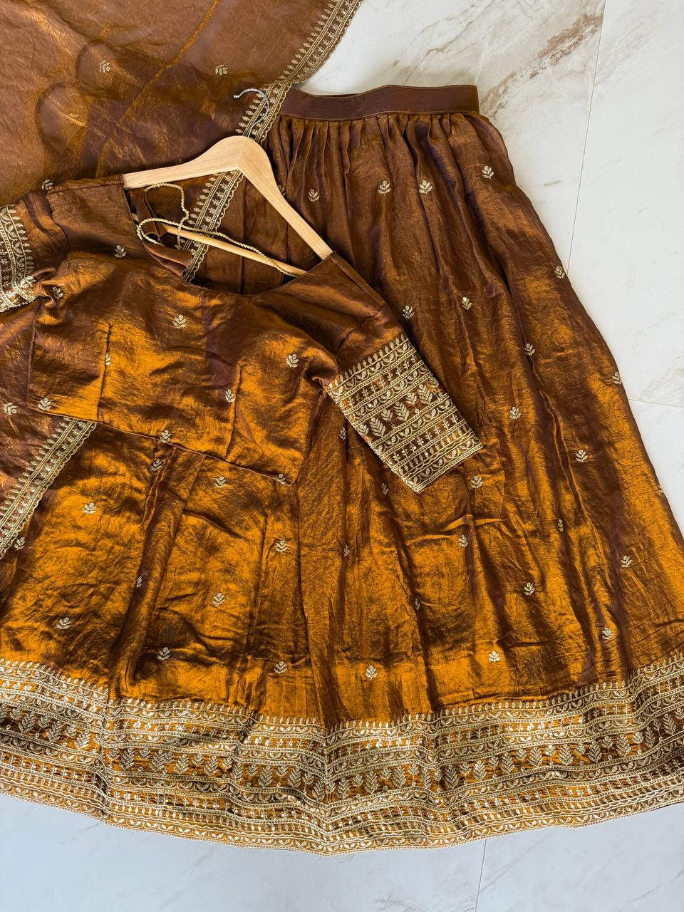 Shivtraa Designs Pvt Ltd has launched a new Tissue Silk Half Saree lehenga Choli in South Indian style