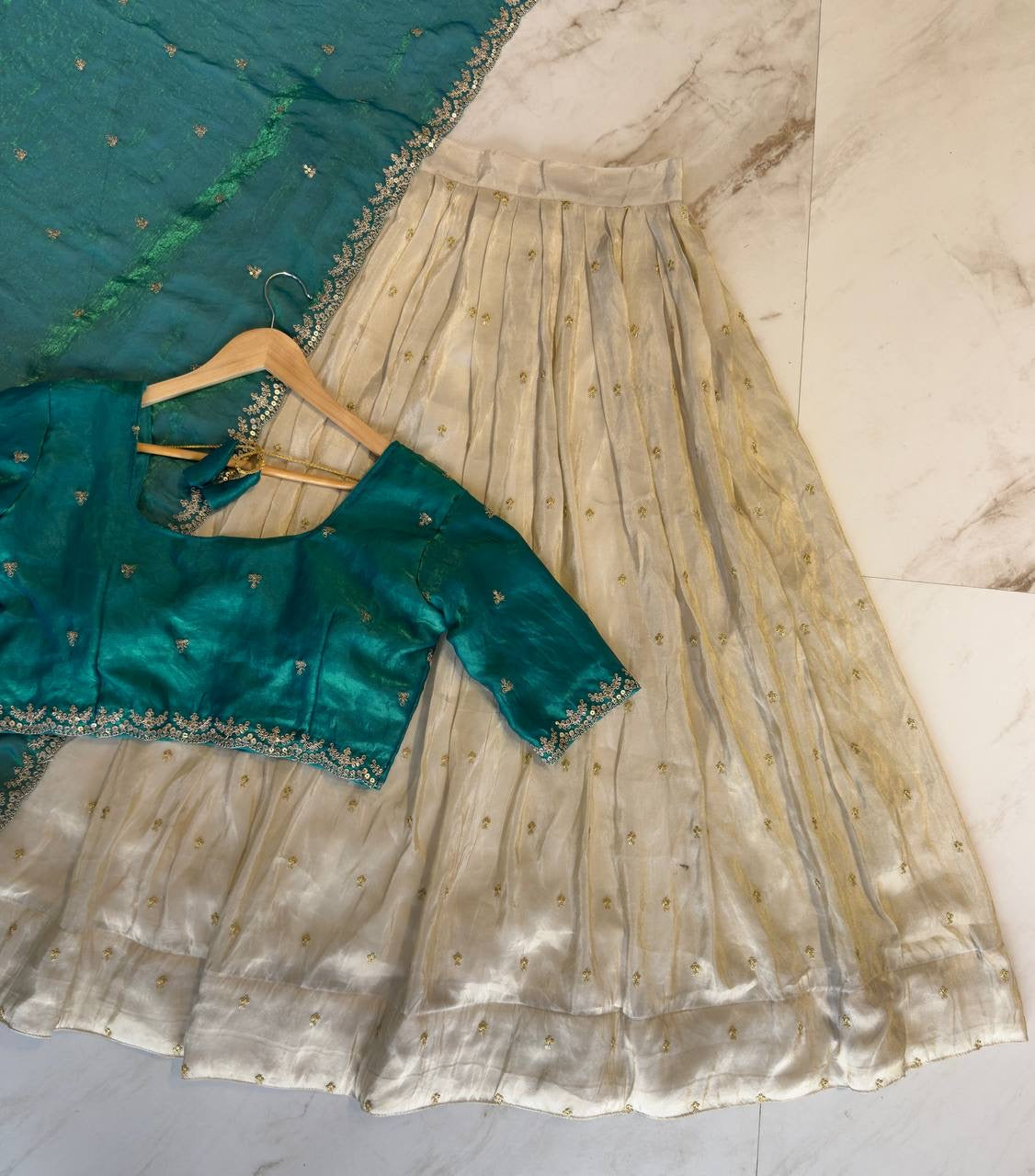 Shivtraa Designs Pvt Ltd has launched a new Tissue Silk Half Saree lehenga Choli in South Indian style
