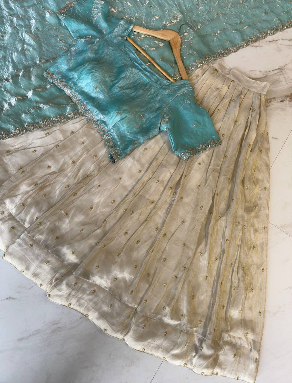 Shivtraa Designs Pvt Ltd has launched a new Tissue Silk Half Saree lehenga Choli in South Indian style