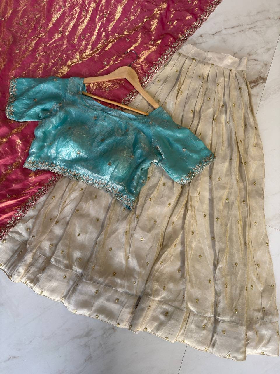 Shivtraa Designs Pvt Ltd has launched a new Tissue Silk Half Saree lehenga Choli in South Indian style