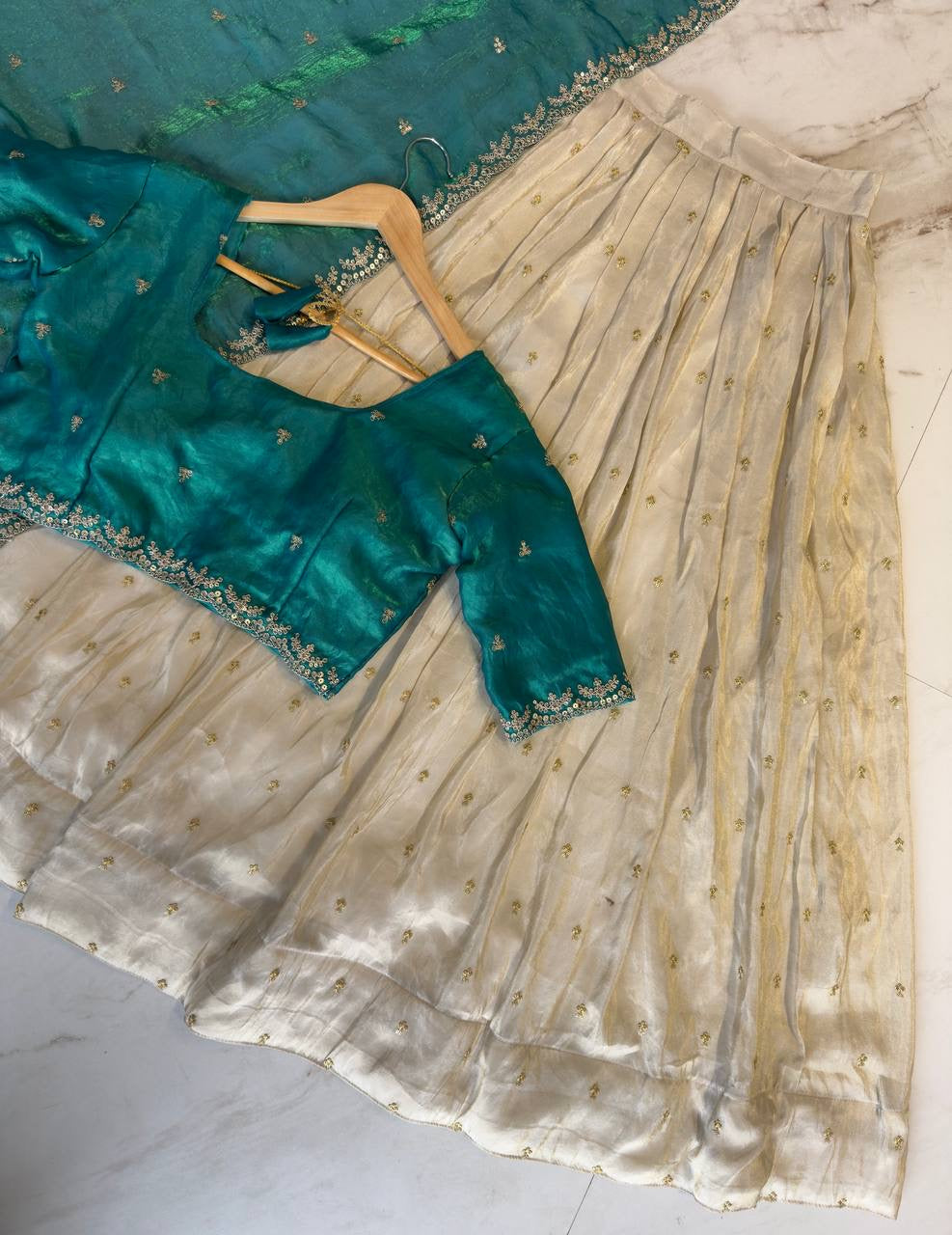 Shivtraa Designs Pvt Ltd has launched a new Tissue Silk Half Saree lehenga Choli in South Indian style
