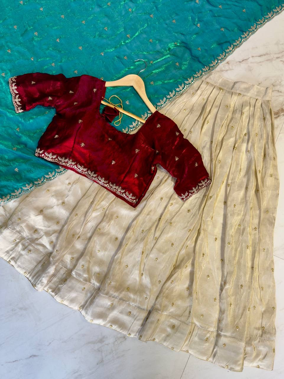 Shivtraa Designs Pvt Ltd has launched a new Tissue Silk Half Saree lehenga Choli in South Indian style