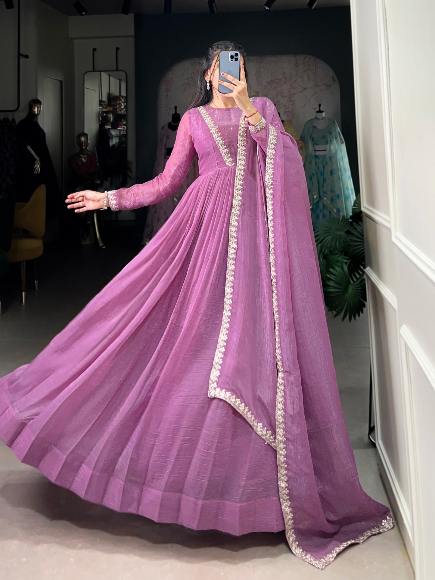Introducing the Shivtraa Lux gown, designed to catch every light with its stunning Silver Gloryshimmer. Perfect for any occasion, this gown combines elegance with comfort.