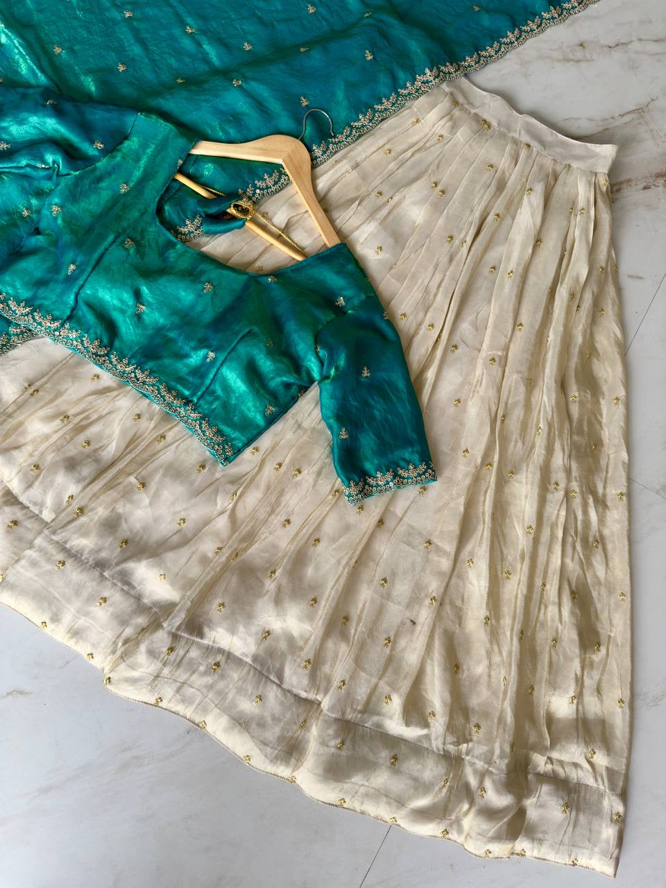 Shivtraa Designs Pvt Ltd has launched a new Tissue Silk Half Saree lehenga Choli in South Indian style