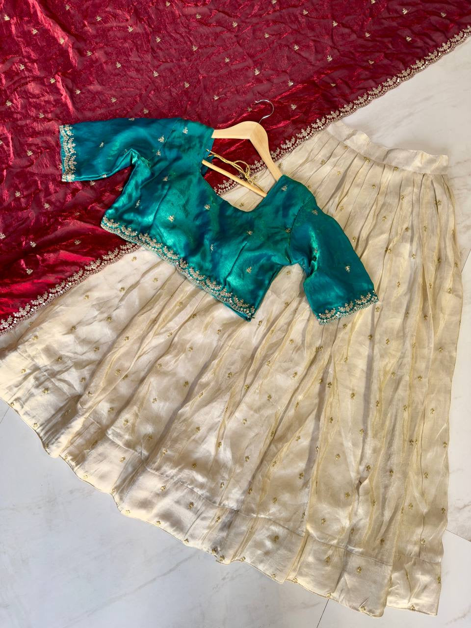 Shivtraa Designs Pvt Ltd has launched a new Tissue Silk Half Saree lehenga Choli in South Indian style
