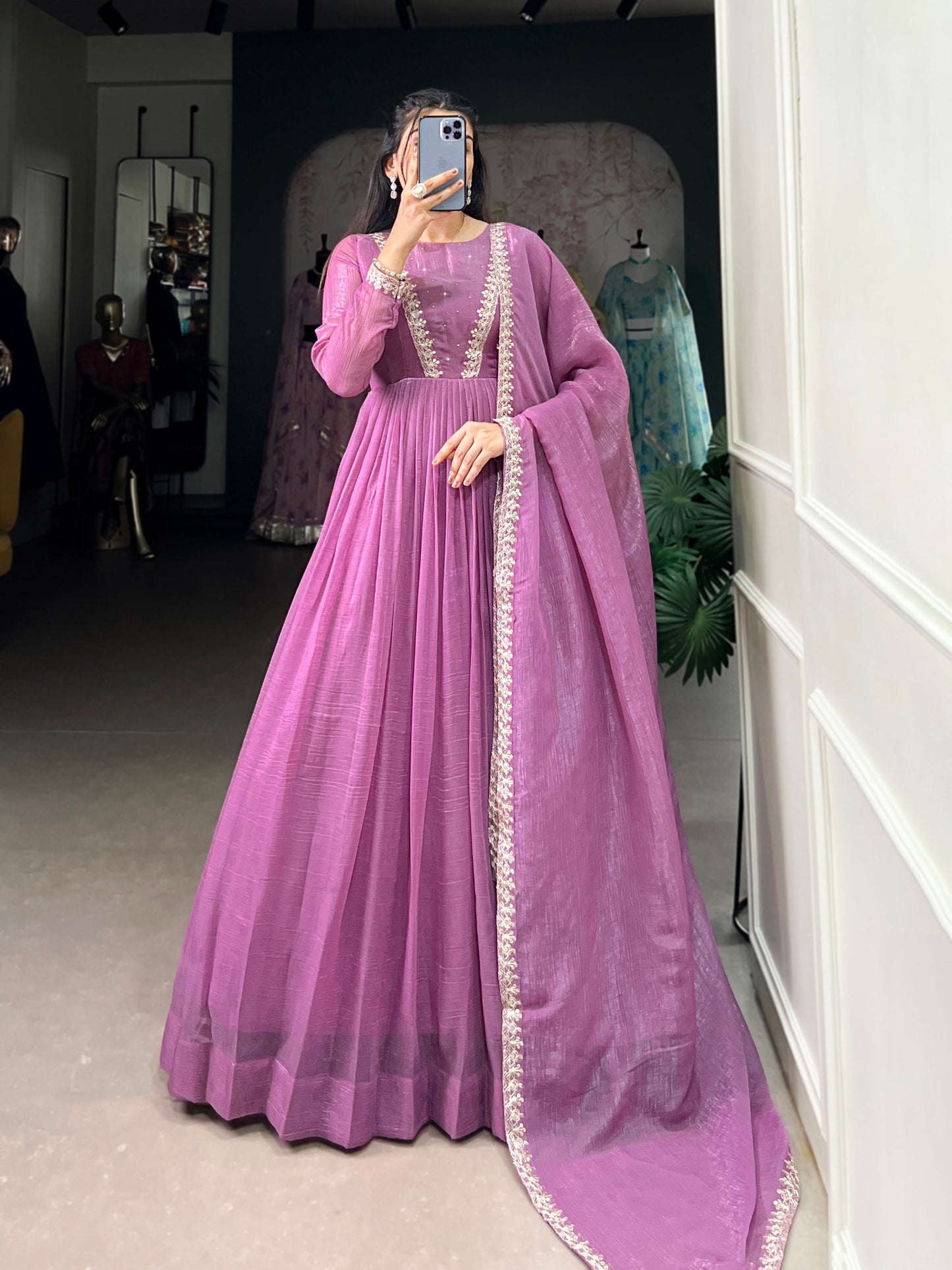 Introducing the Shivtraa Lux gown, designed to catch every light with its stunning Silver Gloryshimmer. Perfect for any occasion, this gown combines elegance with comfort.
