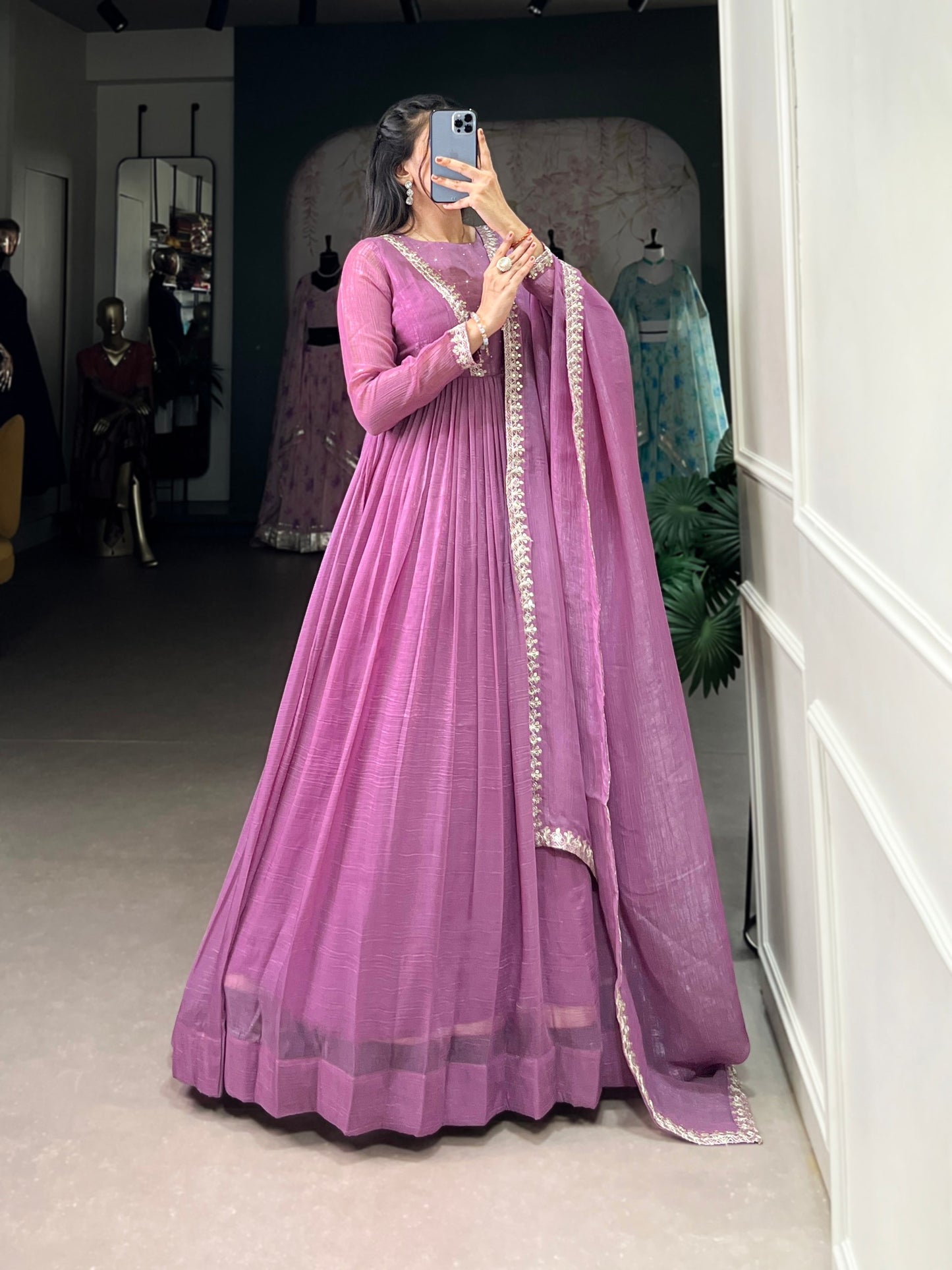 Introducing the Shivtraa Lux gown, designed to catch every light with its stunning Silver Gloryshimmer. Perfect for any occasion, this gown combines elegance with comfort.
