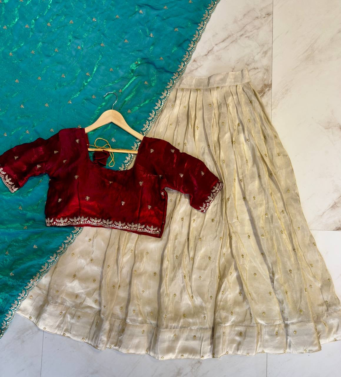 Shivtraa Designs Pvt Ltd has launched a new Tissue Silk Half Saree lehenga Choli in South Indian style