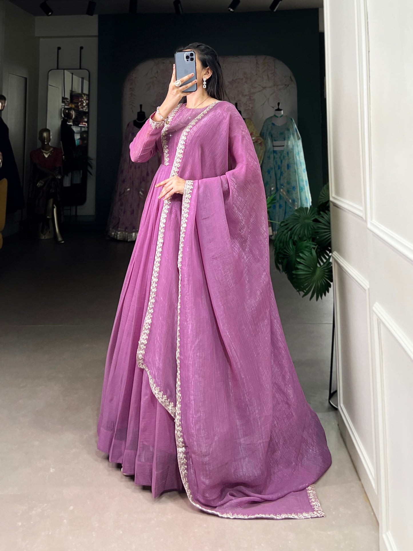 Introducing the Shivtraa Lux gown, designed to catch every light with its stunning Silver Gloryshimmer. Perfect for any occasion, this gown combines elegance with comfort.