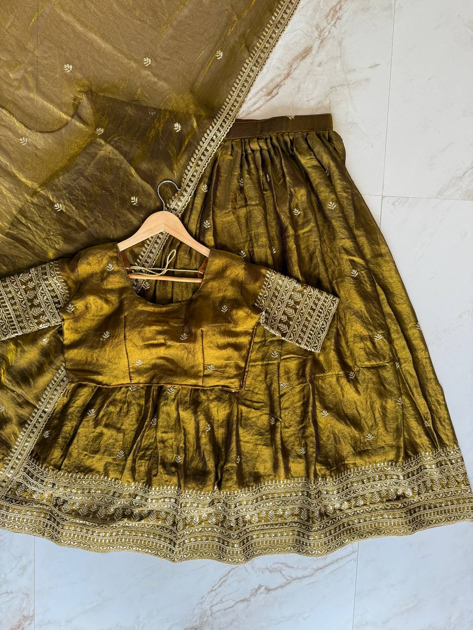 Shivtraa Designs Pvt Ltd has launched a new Tissue Silk Half Saree lehenga Choli in South Indian style