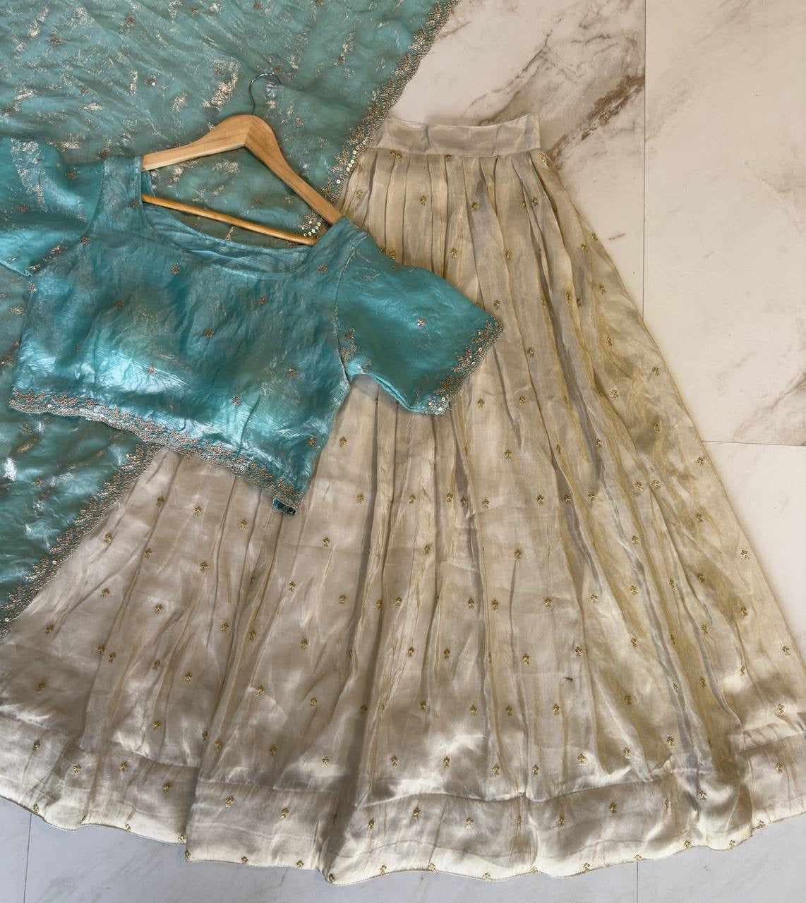 Shivtraa Designs Pvt Ltd has launched a new Tissue Silk Half Saree lehenga Choli in South Indian style